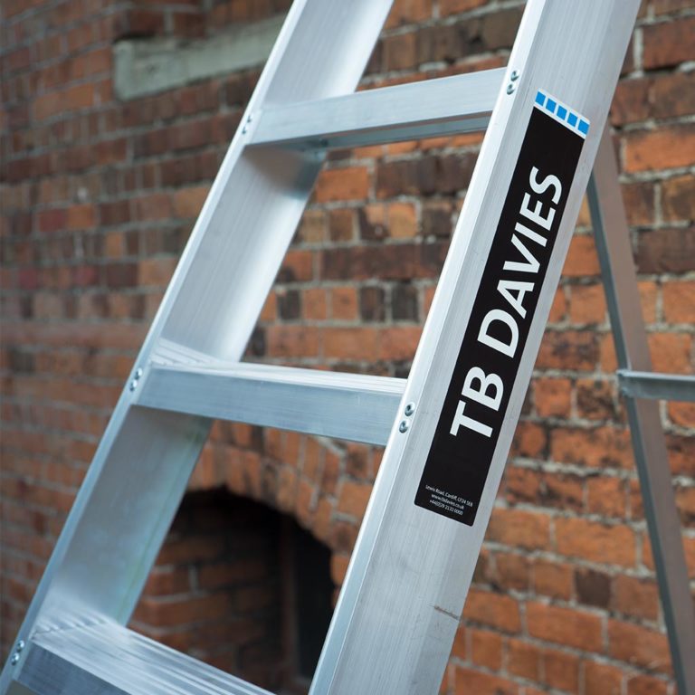 Tread and stile of an industrial professional swingback step ladder