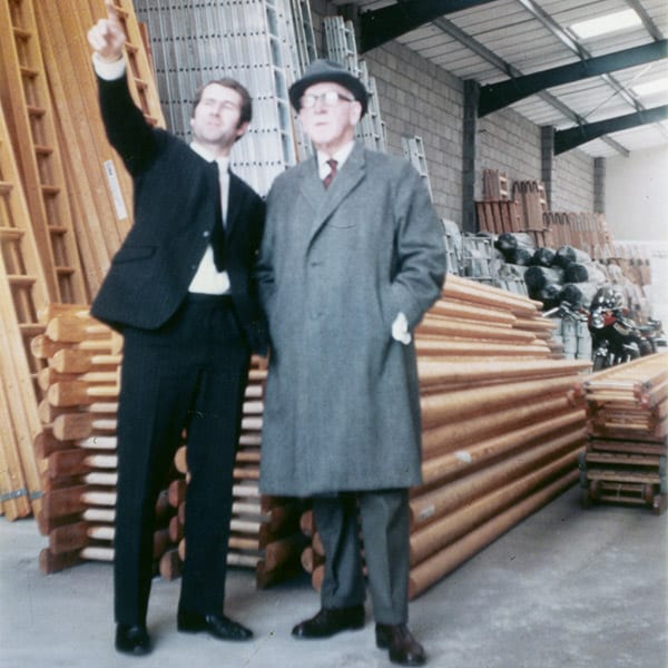 Patrick Gray shows Bryn Davies around the factory in the early 1970s